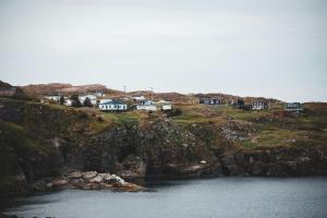 https://www.pexels.com/photo/small-settlement-houses-on-rocky-seacoast-4582608/